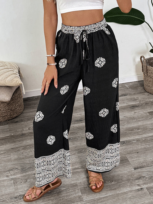 Black and white patterned palazzo pants with elastic waist and drawstring for casual wear