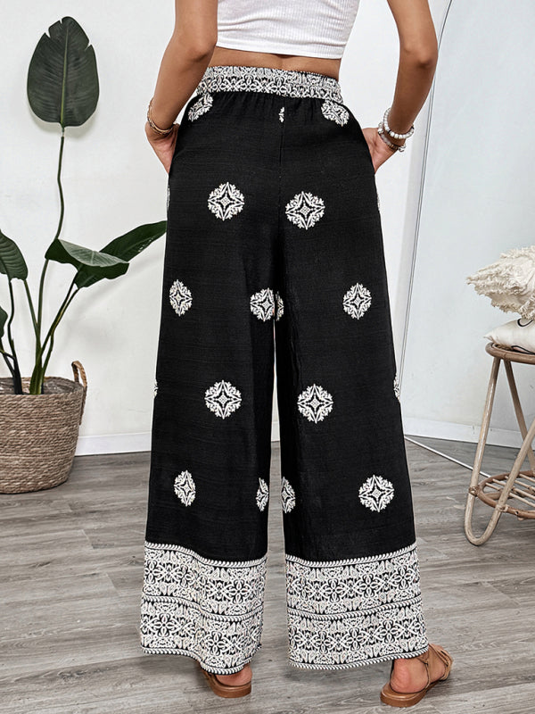 Black and white patterned palazzo pants with elastic waist and drawstring for casual comfort