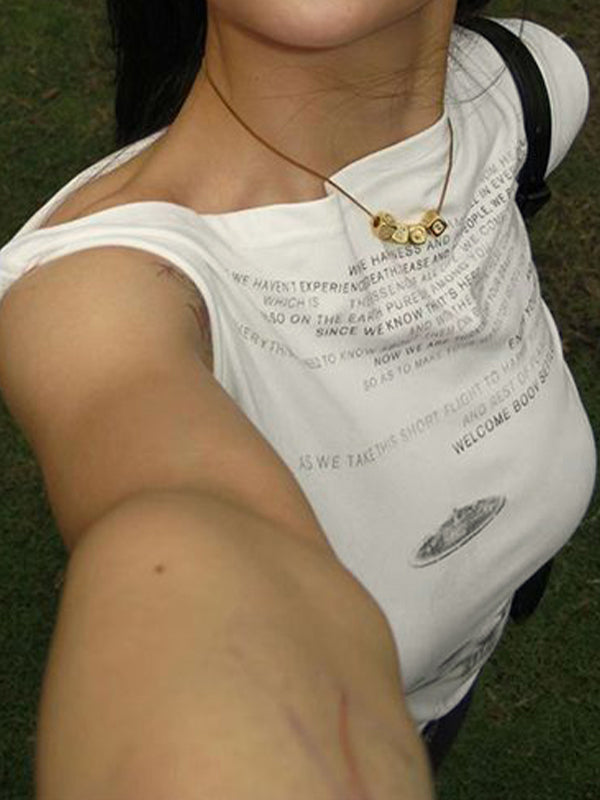 GRAPHIC PRINT TOP WITH BOLD ENGLISH DESIGN