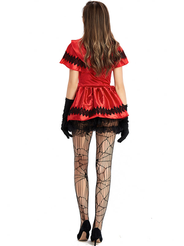 Woman in red dress and spiderweb tights wearing Halloween Little Red Riding Hood Costume
