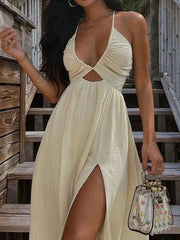 HALTER DRESS WITH THIGH-HIGH SLIT AND DEEP NECKLINE