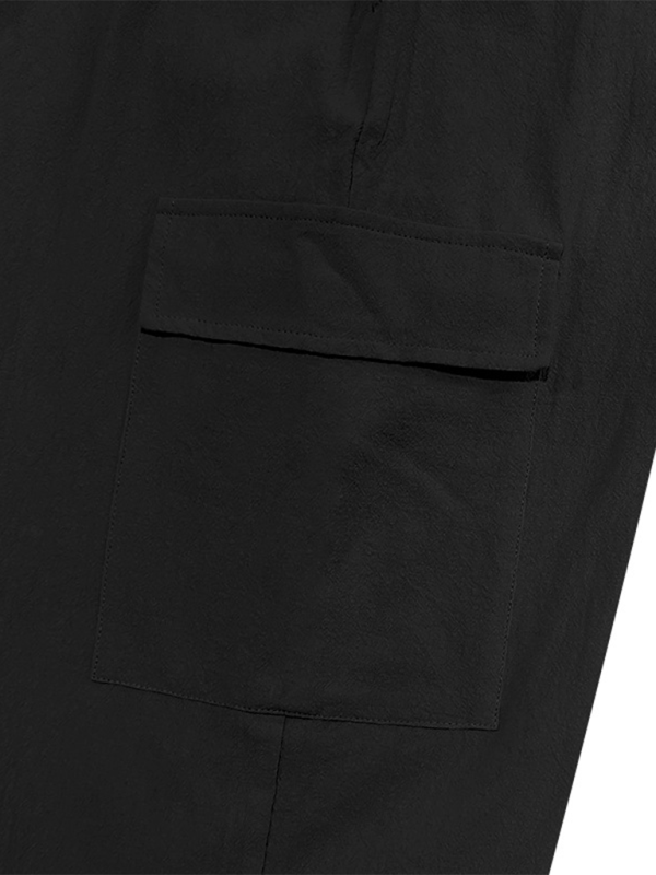 Pantalon ample à cordon de serrage, couleur unie, ourlets décontractés et poches multiples. 