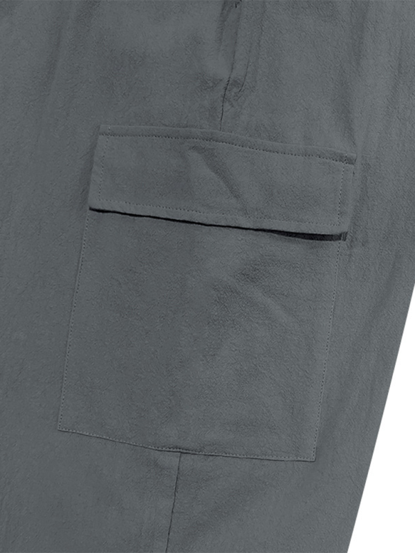 Pantalon ample à cordon de serrage, couleur unie, ourlets décontractés et poches multiples. 