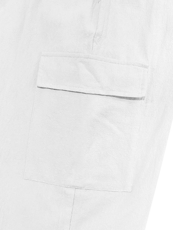 Pantalon ample à cordon de serrage, couleur unie, ourlets décontractés et poches multiples. 
