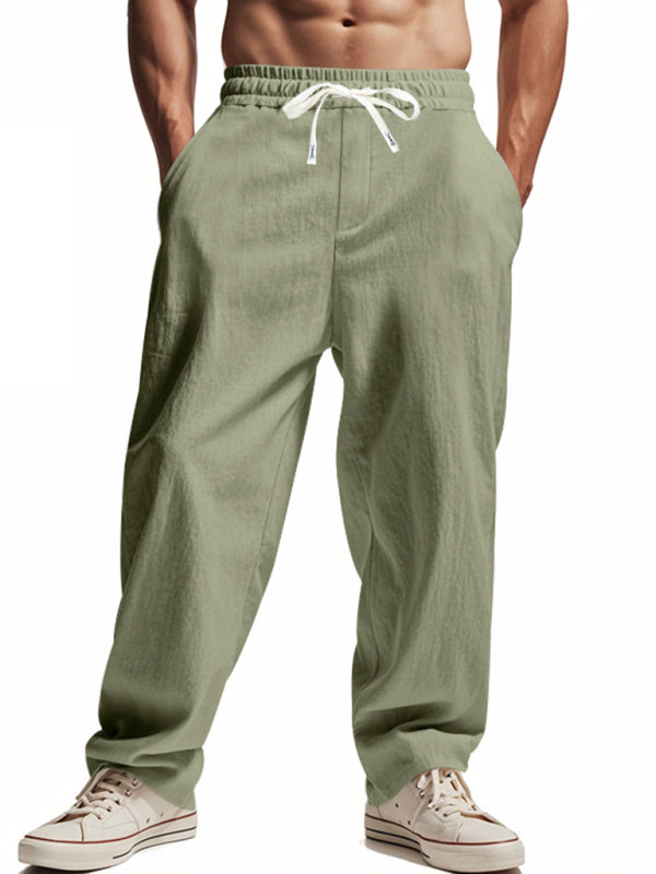 Loose linen cargo pants – sage green front view