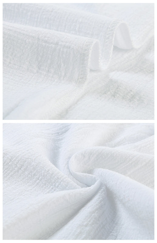 Leinenbluse mit Reverskragen, Knopfleiste, Raglanärmeln und abgerundetem Schlitz am Saum 