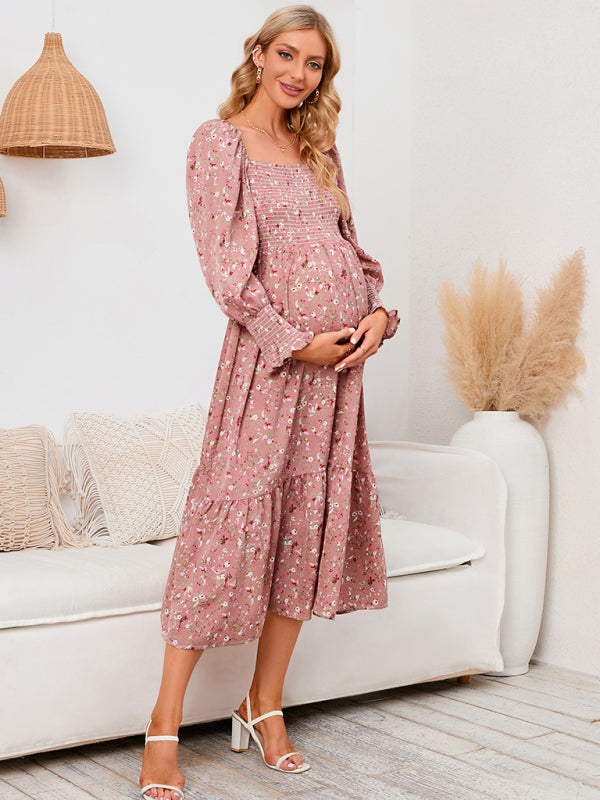 Women's maternity pink floral midi dress with smocked neckline - side view