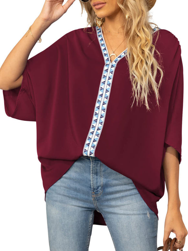 Damen-Chiffonbluse mit Dolmanärmeln, V-Ausschnitt und kurzen Ärmeln 
