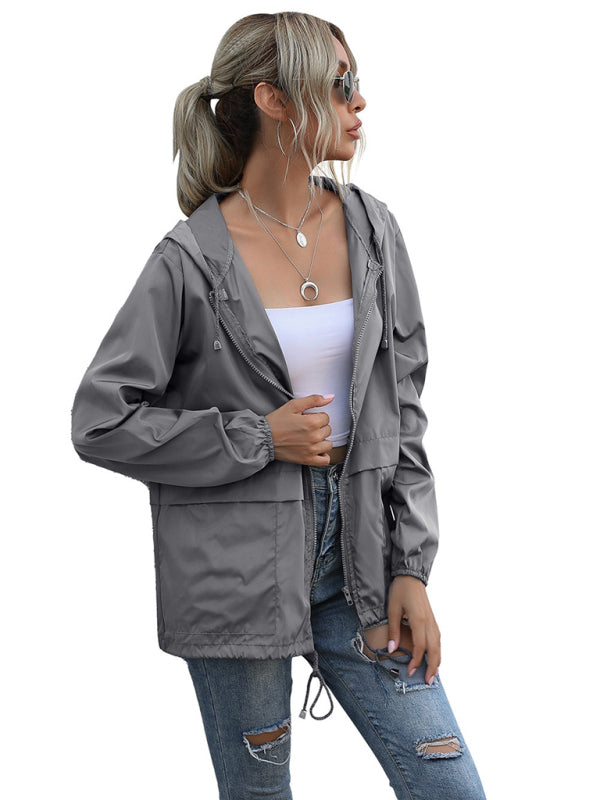 Neue leichte Damen-Regenjacke mit Reißverschluss und Kapuze, ideal für Outdoor-Aktivitäten wie Wandern. 