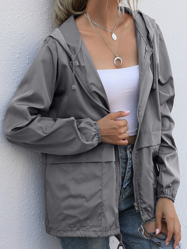 Neue leichte Damen-Regenjacke mit Reißverschluss und Kapuze, ideal für Outdoor-Aktivitäten wie Wandern. 