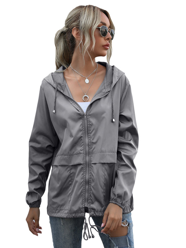 Neue leichte Damen-Regenjacke mit Reißverschluss und Kapuze, ideal für Outdoor-Aktivitäten wie Wandern. 