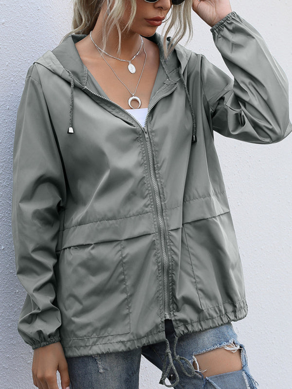Neue leichte Damen-Regenjacke mit Reißverschluss und Kapuze, ideal für Outdoor-Aktivitäten wie Wandern. 