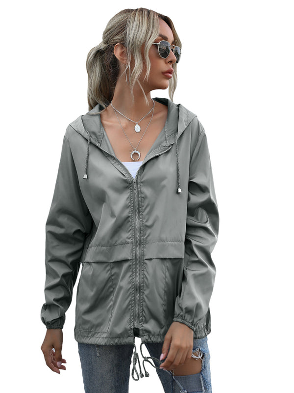 Neue leichte Damen-Regenjacke mit Reißverschluss und Kapuze, ideal für Outdoor-Aktivitäten wie Wandern. 