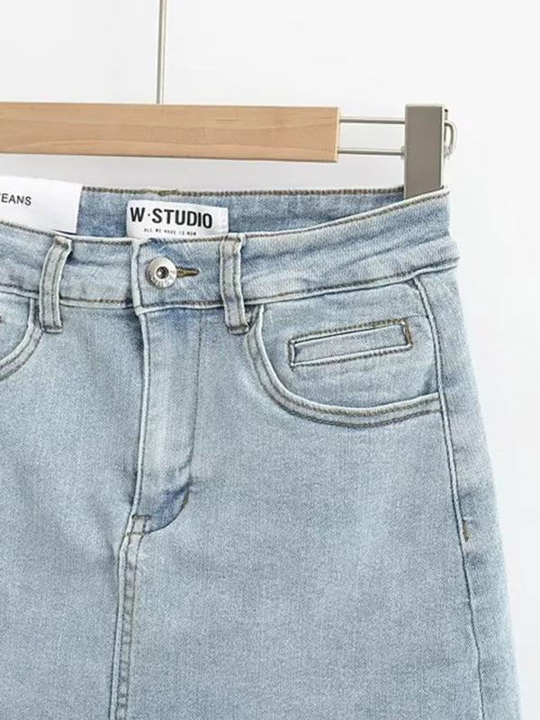 Heißer, hochtaillierter, elastischer, hüftbedeckender, figurbetonter A-Linien-Jeansrock mit offener Kante und blickdichtem Saum. 