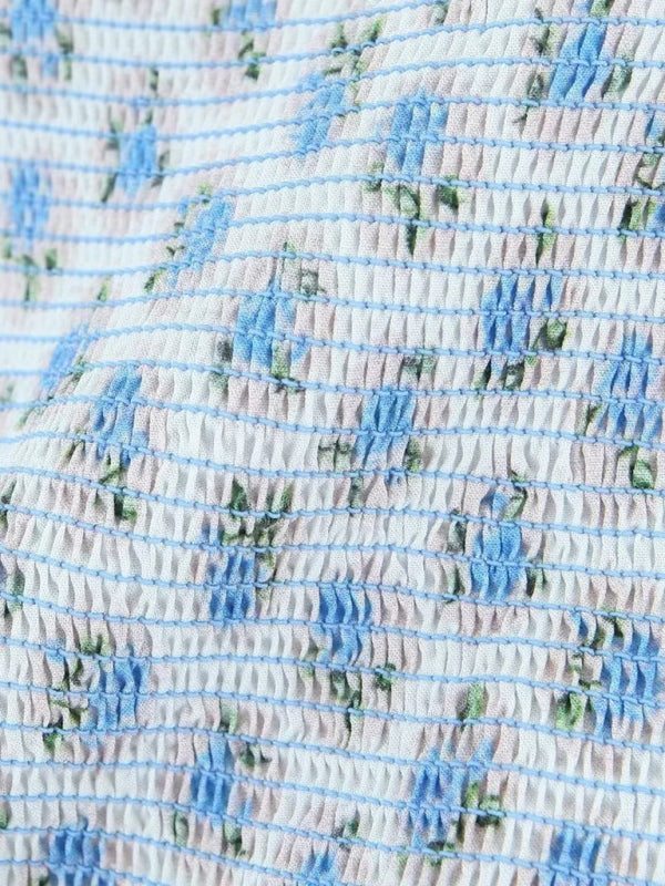 Neues, modisches Kleid mit fliegenden Ärmeln, elastischem Faltenrock, V-Ausschnitt und blauem Blumenmuster 