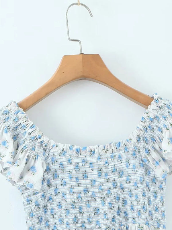 Neues, modisches Kleid mit fliegenden Ärmeln, elastischem Faltenrock, V-Ausschnitt und blauem Blumenmuster 