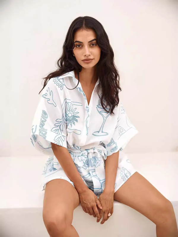 Women's white short jumpsuit with contemporary print – front view