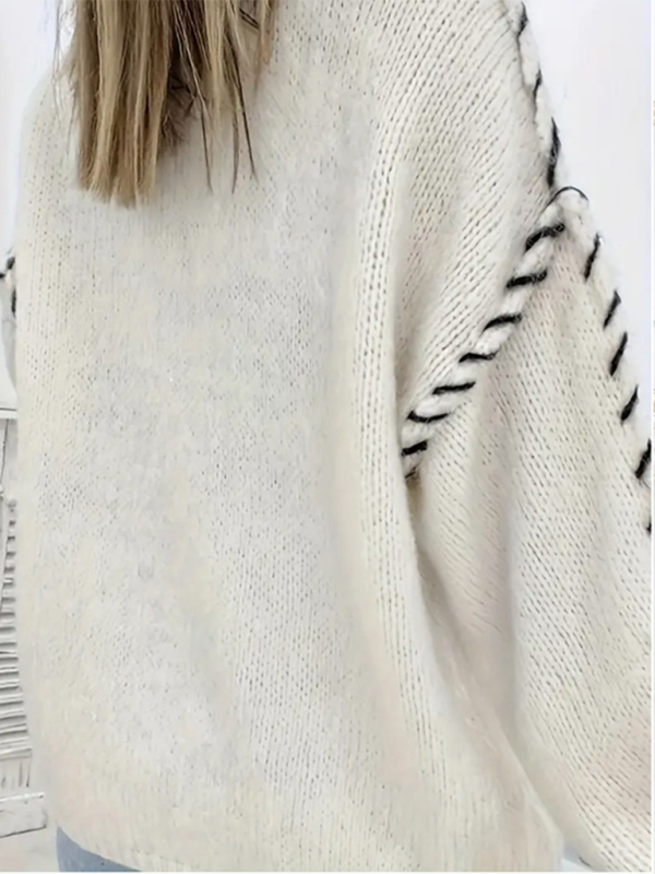 Pull-over femme uni à col rond, manches longues et cordon de serrage, coupe ample, en maille. 