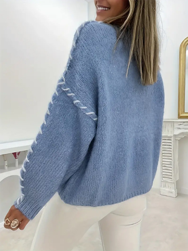 Pull-over femme uni à col rond, manches longues et cordon de serrage, coupe ample, en maille. 