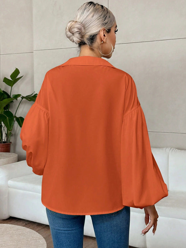 Long-fitting, puff-sleeved top with a semi-open collar – detail view