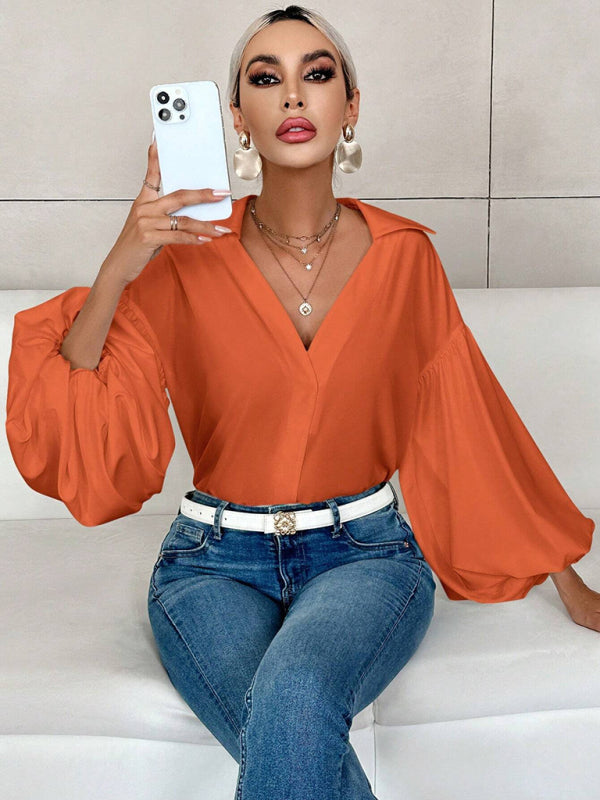 Long-fitting, puff-sleeved top with a semi-open collar – closeup view