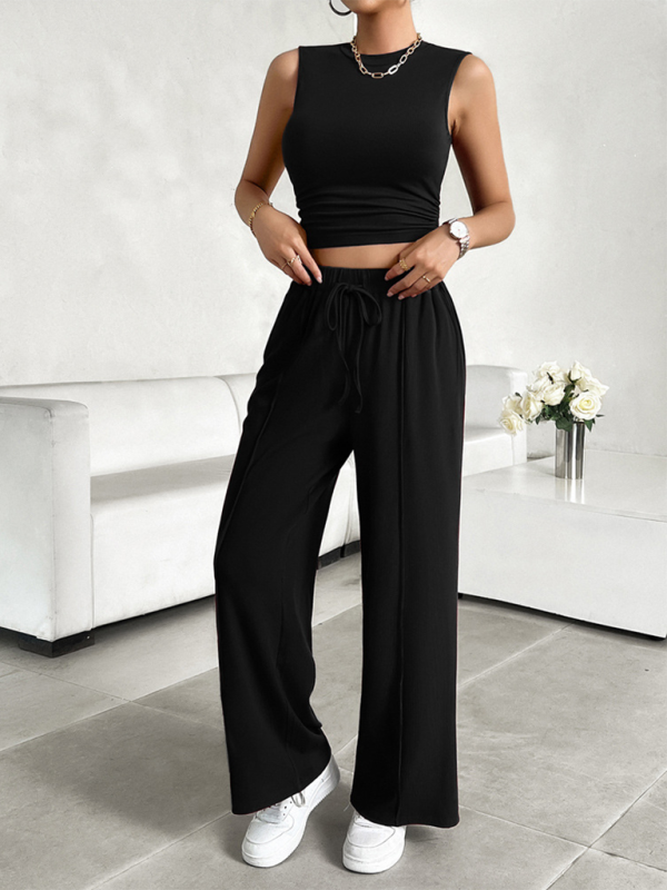 Black two-piece outfit featuring a casual round neck sleeveless top and trousers with comfortable fit