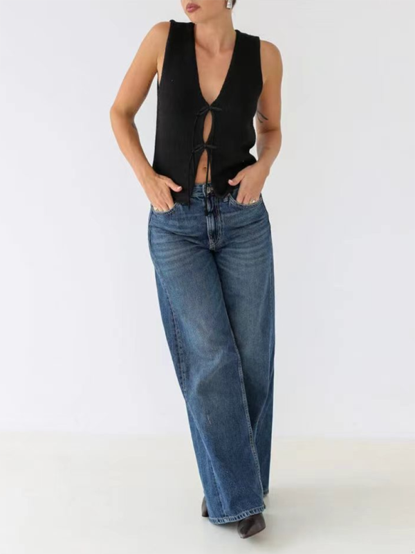 Woman wearing black knit vest with wide-leg jeans showcasing fine weaving type