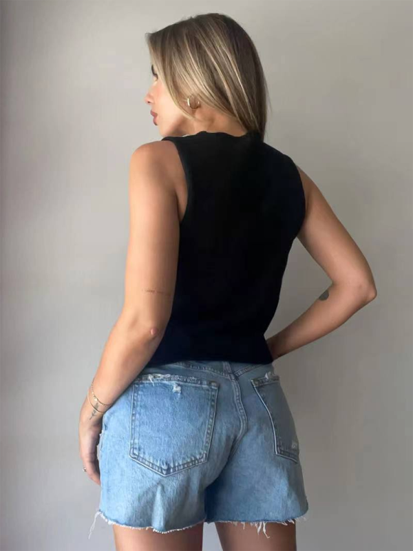 Woman wearing black tank top and denim shorts showcasing weaving type of the rope woolen vest