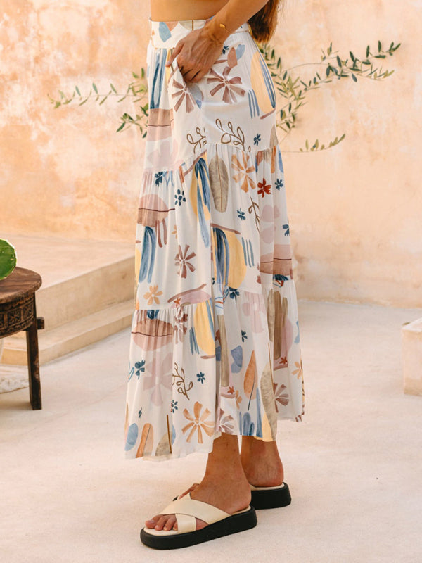 White floral-patterned tiered skirt made of polyester fabric from New White Plant Print Bohemian Holiday Beach Skirt collection