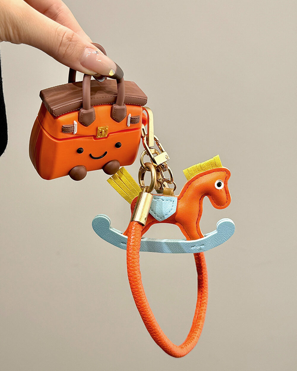 ORANGE ROCKING HORSE HANDBAG AIRPODS CASE