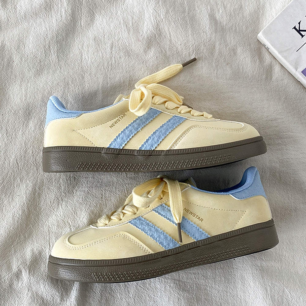 PASTEL YELLOW SNEAKERS WITH LIGHT BLUE ACCENTS