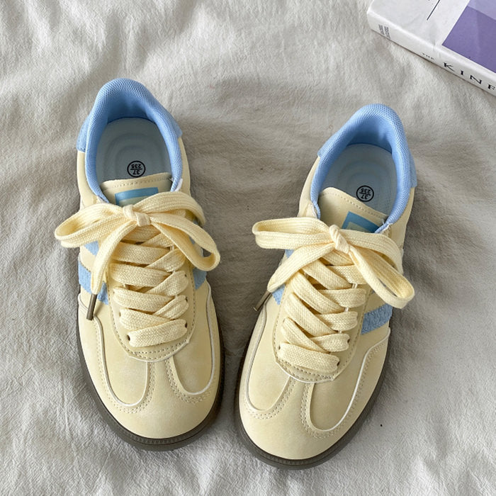 PASTEL YELLOW SNEAKERS WITH LIGHT BLUE ACCENTS