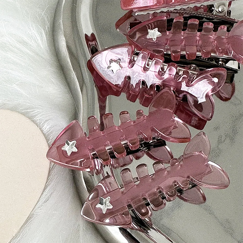 PINK FISH SKELETON HAIR CLIP WITH STAR