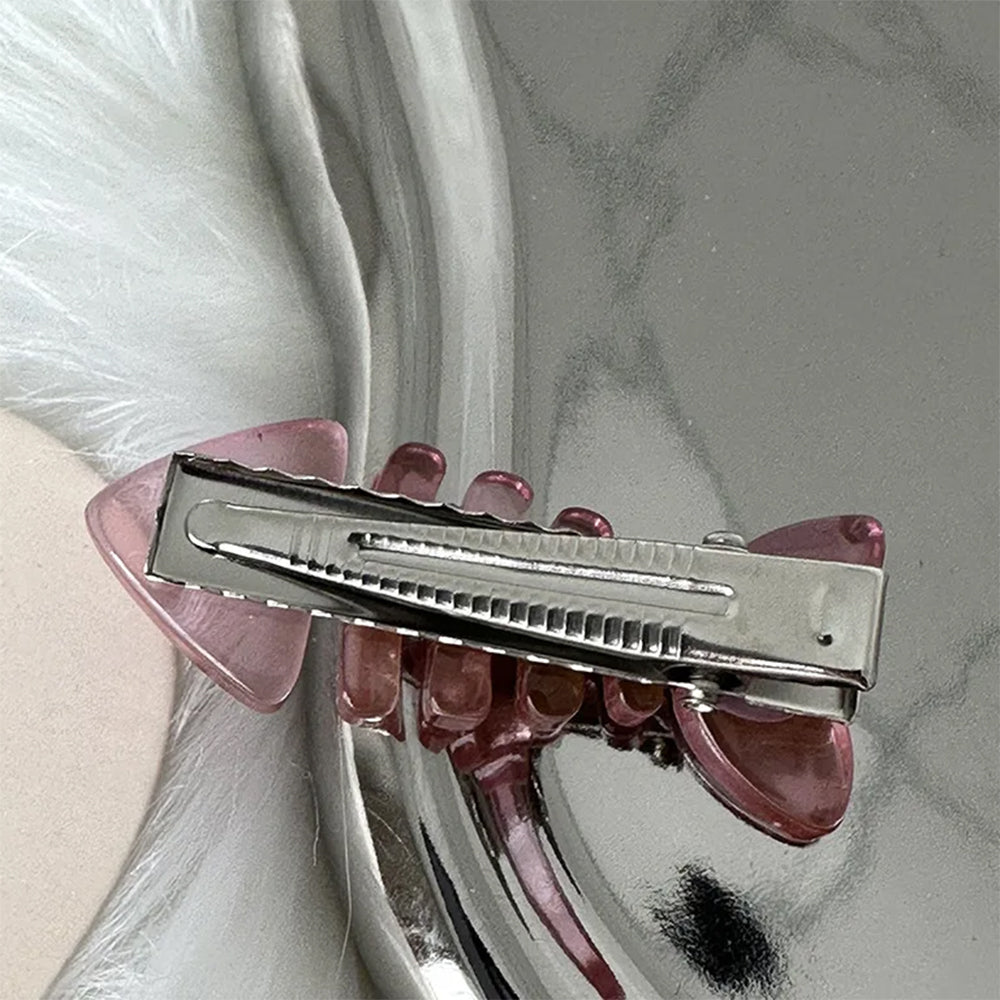PINK FISH SKELETON HAIR CLIP WITH STAR