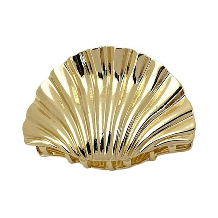 SEASHELL GOLD HAIR CLAW EMBODIES ELEGANT STYLE