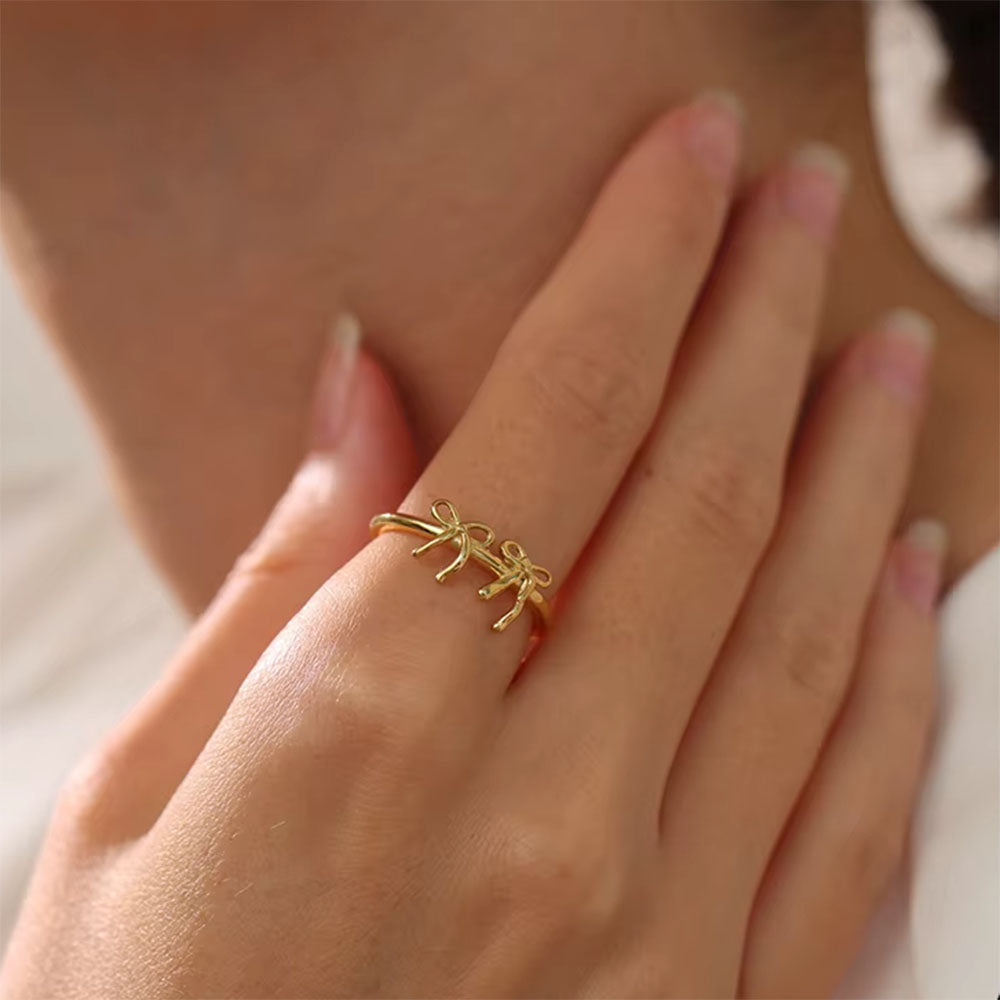 SILVER DOUBLE BOW RING PLAYFUL ELEGANCE JEWELRY COLLECTION