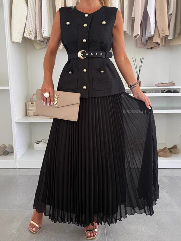 Woman wearing a black sleeveless vest and pleated mesh skirt outfit from Chanel style set