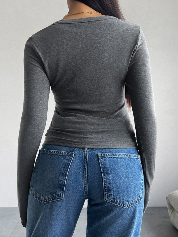 Gray long-sleeved shirt and blue jeans displayed in Slim Fit V-Neck Button Long Sleeve T-Shirt