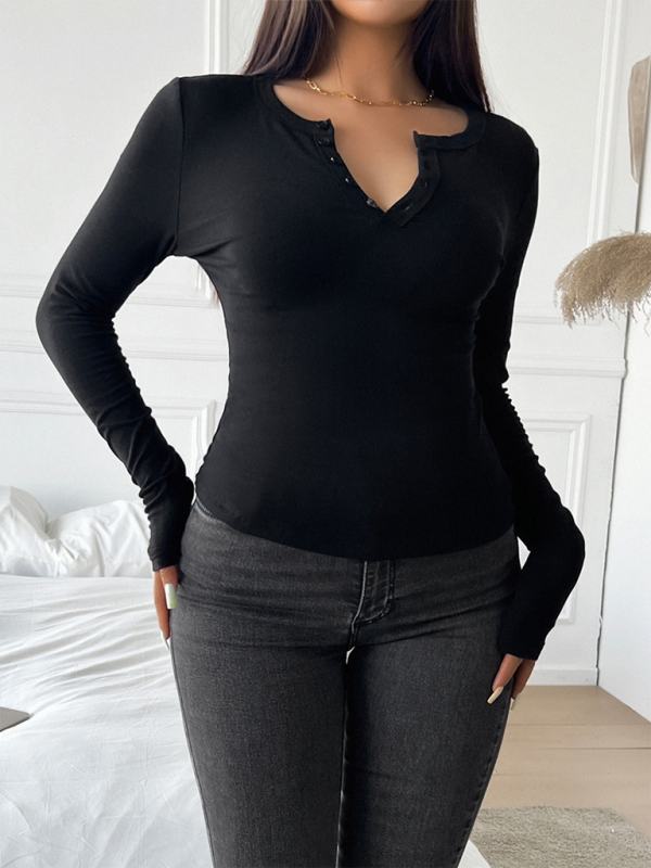 Black long-sleeved V-neck button T-shirt paired with gray jeans for a stylish look