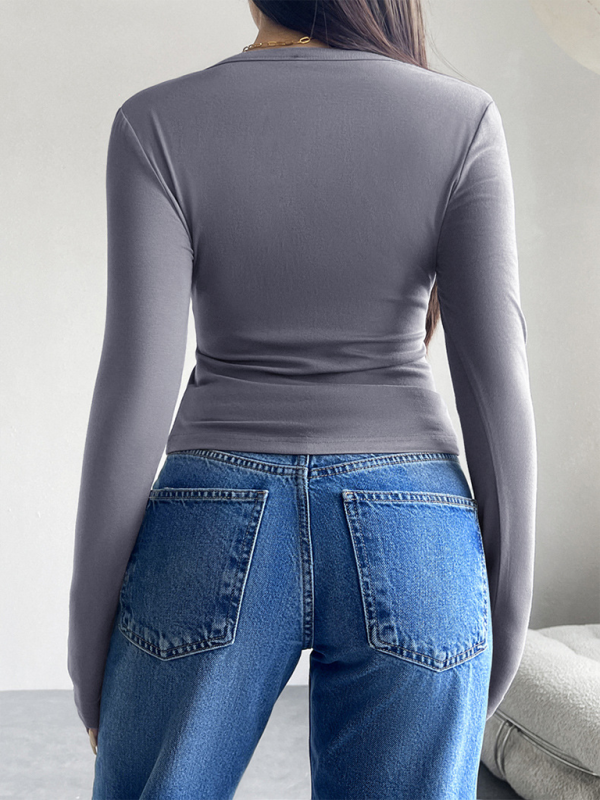 Gray long-sleeved shirt and blue jeans, perfect for a solid color cardigan outfit