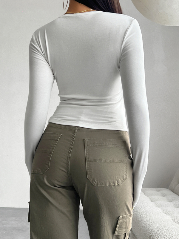 White long-sleeved shirt and olive green cargo pants, perfect for a solid color casual look