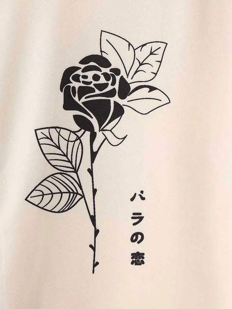 TWO-TONED SHORT-SLEEVED SHIRT WITH ROSE AND ABSTRACT FACE DESIGN