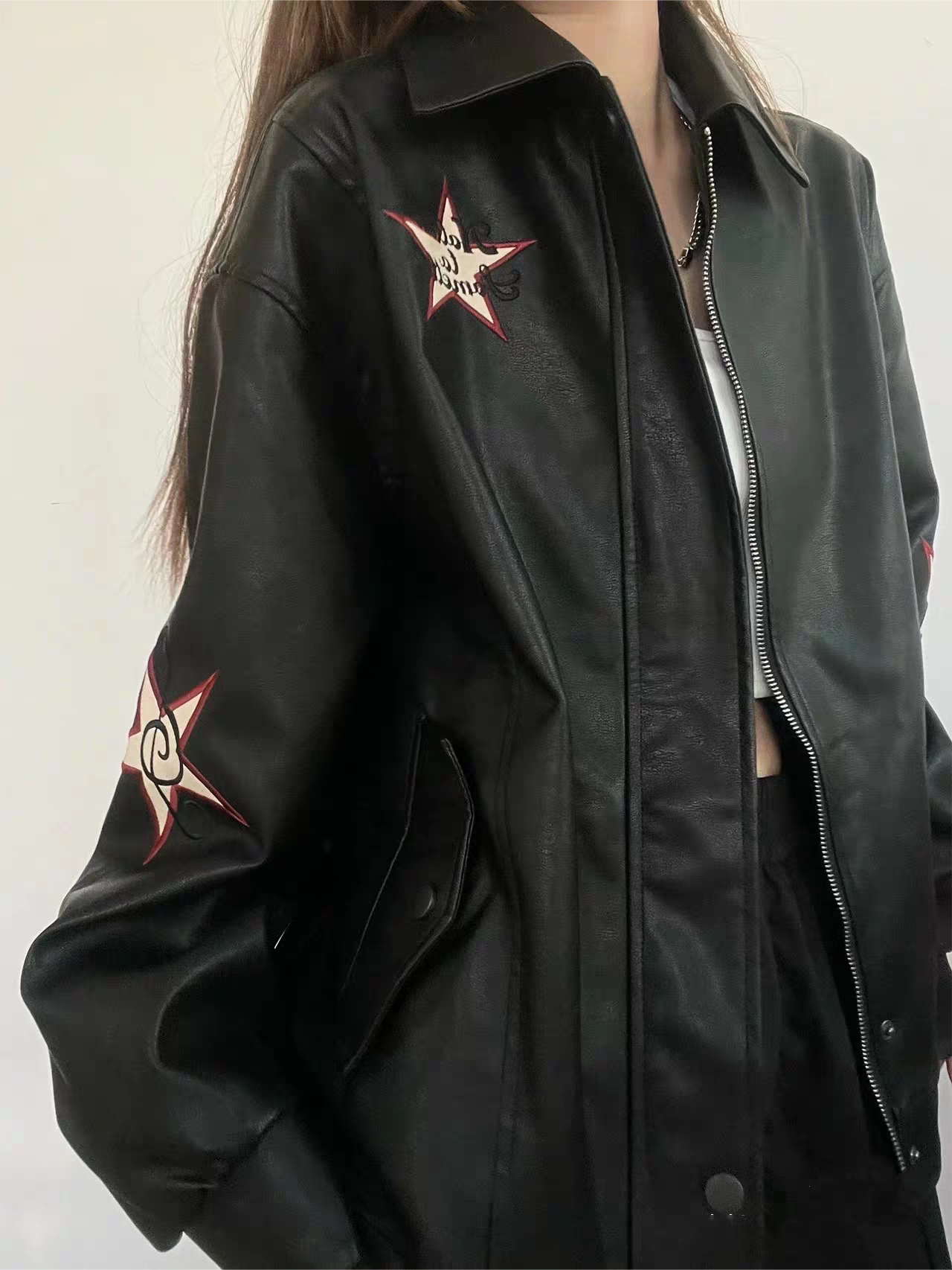 VERSATILE BLACK LEATHER JACKET WITH STAR EMBELLISHMENTS