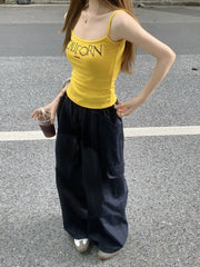VIBRANT YELLOW CAMI AND BLACK CARGO PANTS SET WITH BOLD LETTER PRINT