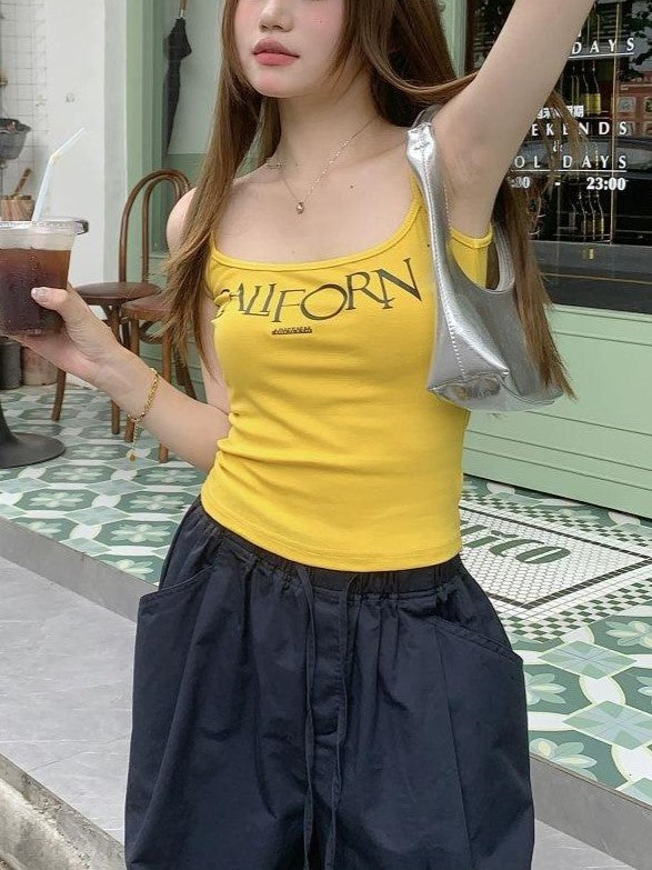 VIBRANT YELLOW CAMI AND BLACK CARGO PANTS SET WITH BOLD LETTER PRINT