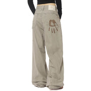 VINTAGE-INSPIRED WIDE-LEG FADED JEANS WITH ARTISTIC BACK POCKET