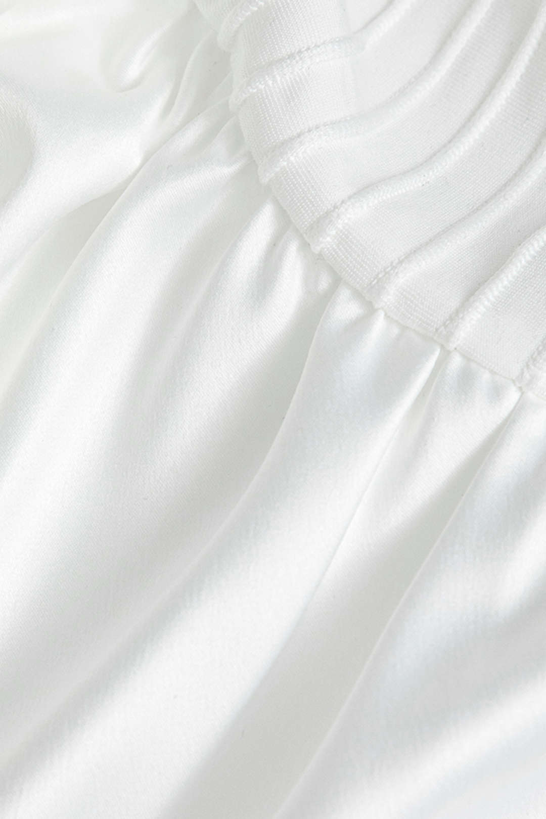 WHITE RIBBED KNIT MINI DRESS WITH RUFFLE TRIM AND BELL SLEEVES