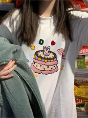 WHITE T-SHIRT WITH CARTOON CAKE DESIGN FOR VERSATILE CASUAL OUTFITS