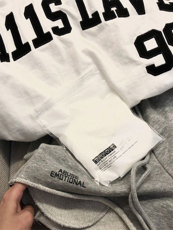 WHITE TANK TOP WITH OVERSIZED LETTER PRINT