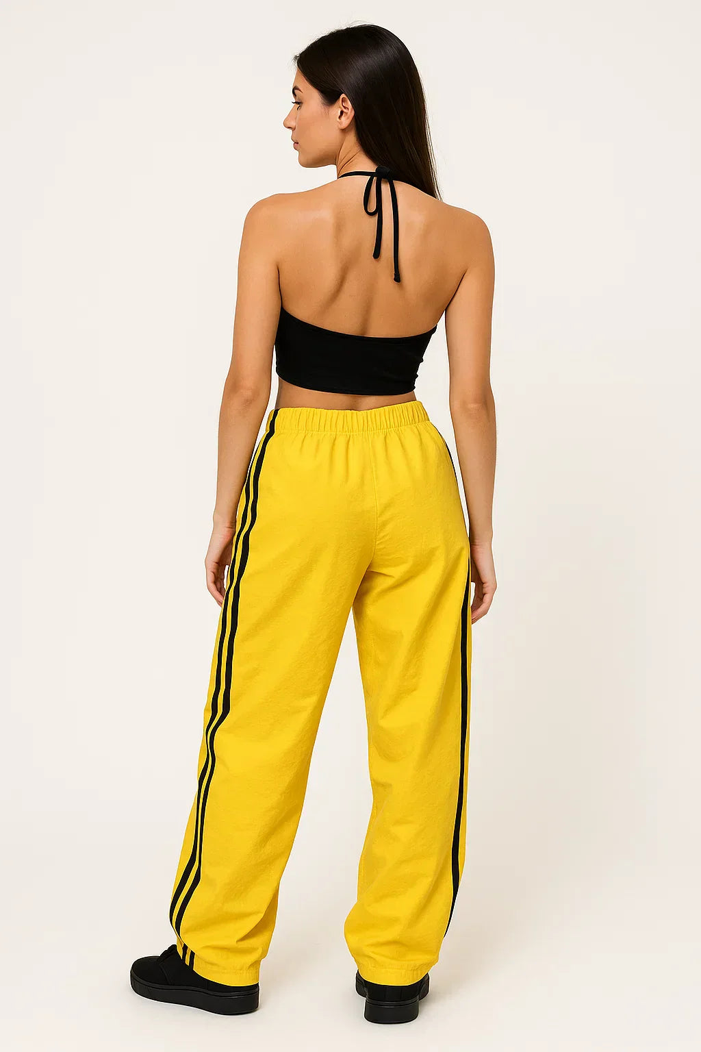 WOMAN'S BLACK HALTER TOP AND YELLOW TRACK PANTS FOR STREET STYLE